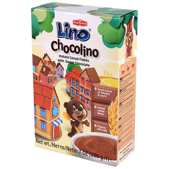 Box of Lino Chocolino instant cereal flakes with a cartoon dog character and village scene on the packaging.